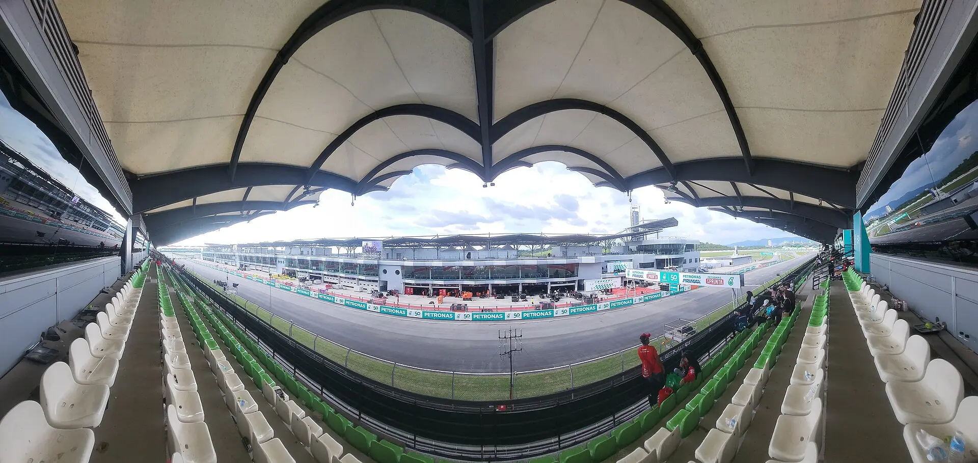 The main grandstand at Sepang seen from inside, looking out across the pit lane and main straight